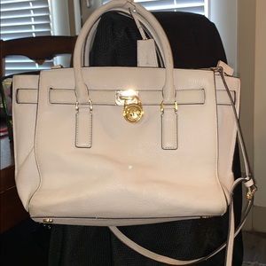 Michael Kors white purse with gold.